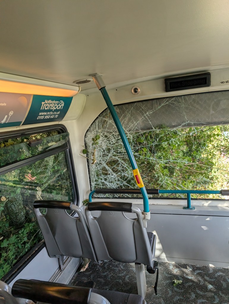 Interior of the Silverstone F1 shuttle bus crash. The impact shows thick branches entering the windows.